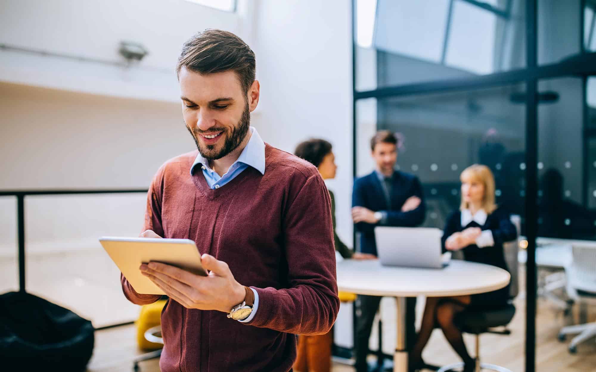 Business person checking ipad in office