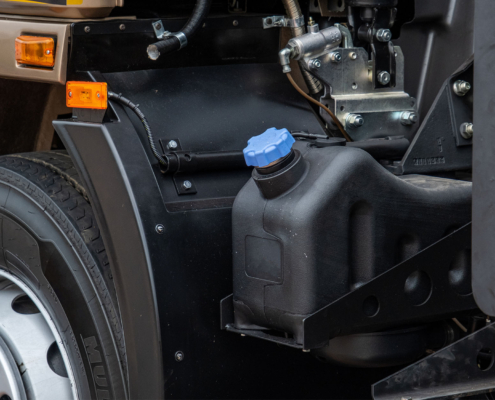 Side view of truck and agricultural vehicle fuel system