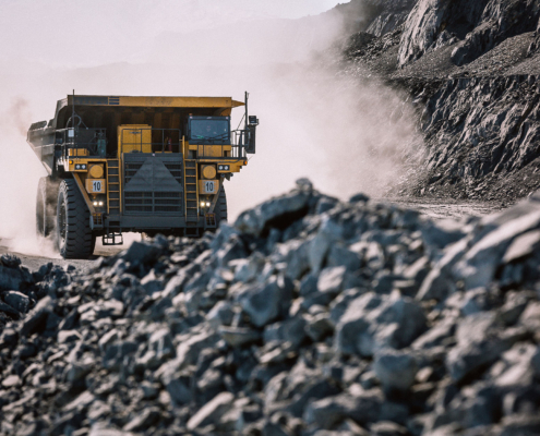Career dump truck is going to the gold mining range