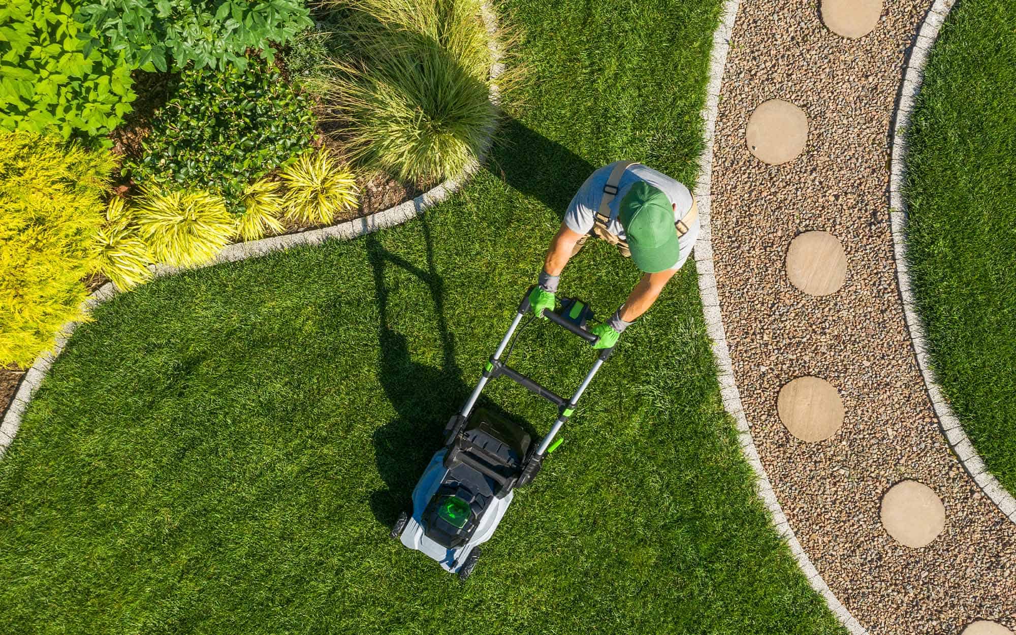 Gardener Mowing Backyard Garden Grass Aerial View