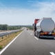 Back View Of A Semi Truck Driving Down The Road