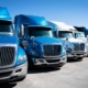 Fleet Of Blue 18 Wheeler Semi Trucks