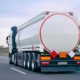 Side View Of A Semitruck Driving Down The Highway