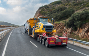 Special Transport Truck Carrying Large Construction Machinery On A Trailer