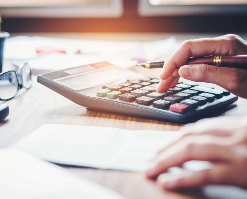 finance-accounting-concept.-pen-and-calculator-on-table Finance Accounting Concept. Pen And Calculator On Table